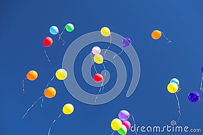 Many bright baloons in the blue sky Stock Photo