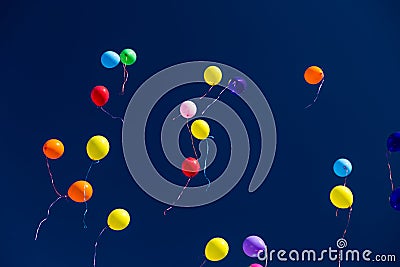 Many bright baloons in the blue sky Stock Photo