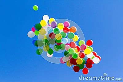 Many bright baloons in the blue sky Stock Photo