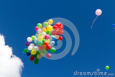 Many bright baloons in the blue sky Stock Photo