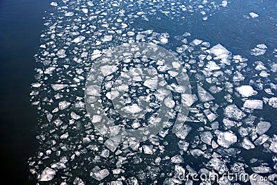 Many broken small ice floes floating on the river aerial aerial view Stock Photo