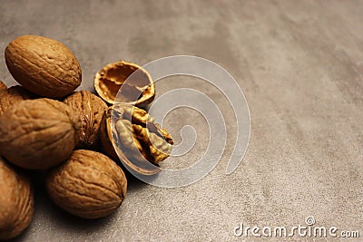 Many brown walnuts on old table Stock Photo