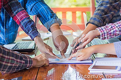 Many business people point to the graph. Creative idea teamwork Stock Photo