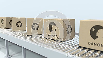 Many cartons with DANONE logo move on roller conveyor. Editorial 3D rendering Editorial Stock Photo