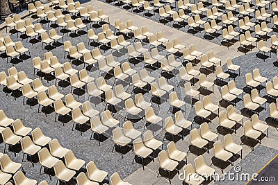 Many chairs for an audience in the amphitheater create a nice pattern Stock Photo