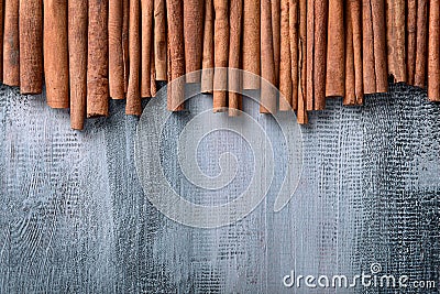 Many cinnamon sticks on wooden background, top view Stock Photo