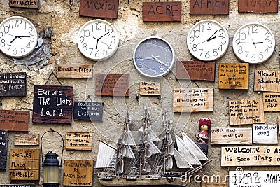 Many clocks hang on the wall, and reviews from tourists Editorial Stock Photo