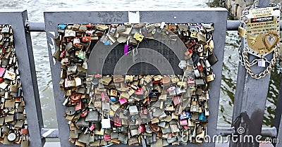 Many closed lock on the Bridge of love in Helsinki Editorial Stock Photo