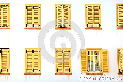 Many closed windows with shutters Stock Photo