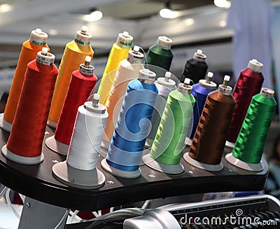 Many coils with colored thread. Clothing industry Stock Photo
