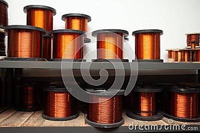 Many coils of copper wire in the production workshop, winding copper cable on spools Stock Photo