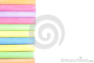 Colored children`s crayons lying in one line on a white background isolated Stock Photo