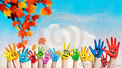 Many colored hands with smileys Stock Photo