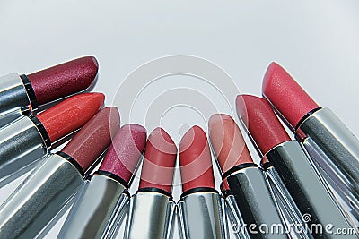 Many colored lipsticks lie in a semicircle Stock Photo