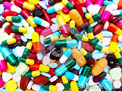 Many colorful pills, tablets and capsules medical drug. Concept Stock Photo