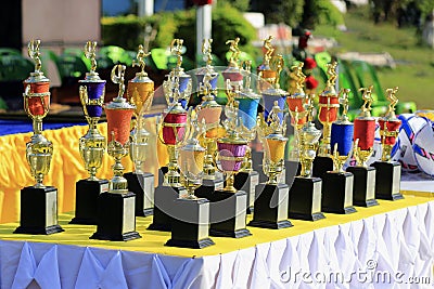 Many colorful sports trophies, football, Petanque, volleyball, rattan ball Stock Photo