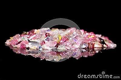 Many colorful Tourmaline splinter in front of black background w Stock Photo