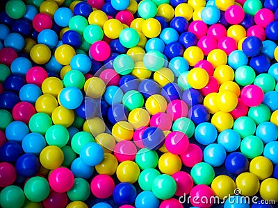 Many colour plastic balls, children`s party, a games room, a box filled with small colored balls Stock Photo