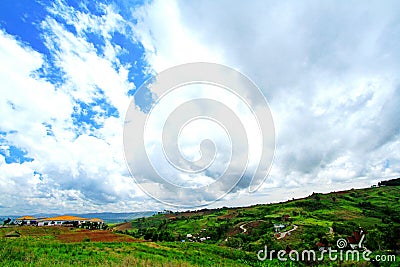 Many country houses on the high mountains hill with beautiful blue sky Stock Photo