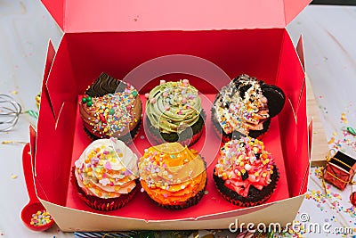 Many cupcake in the box. Cupcake with cream and Sprinkles Sugar love valentines .Beautiful and delicious cupcake. Stock Photo