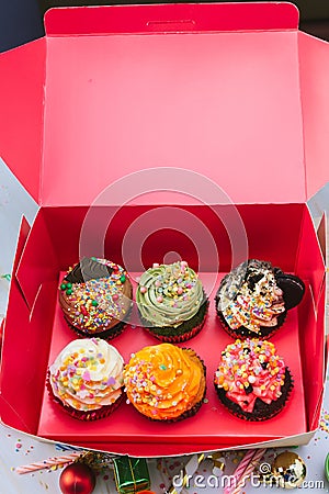 Many cupcake in the box. Cupcake with cream and Sprinkles Sugar love valentines .Beautiful and delicious cupcake. Stock Photo