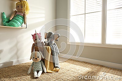 Many cute toys indoors. Baby room interior Stock Photo