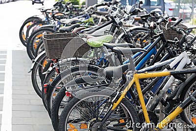 many different colorful bicycles parked public place Stock Photo