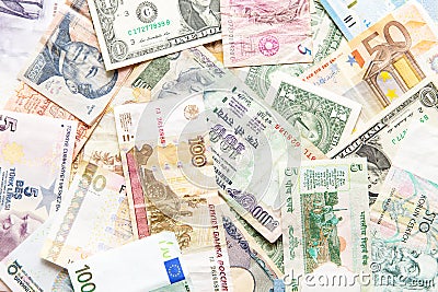 Many different currencies as background Stock Photo