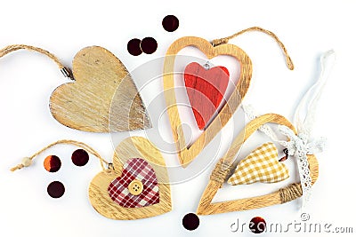 Many different decorative hearts on wood . Stock Photo