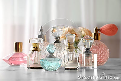 Many different perfume bottles on table Stock Photo
