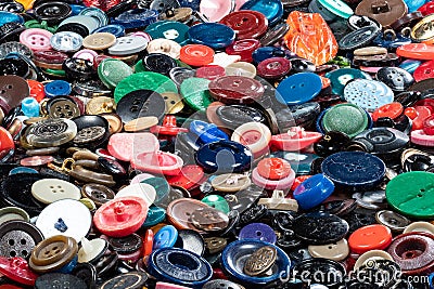 Many different used buttons on surface closeup Stock Photo