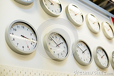 Many different wall clock on the wall. Clock shop.shopping time concept. Big sale time Stock Photo
