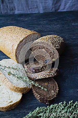 Many diverse bread on a wooden board Stock Photo