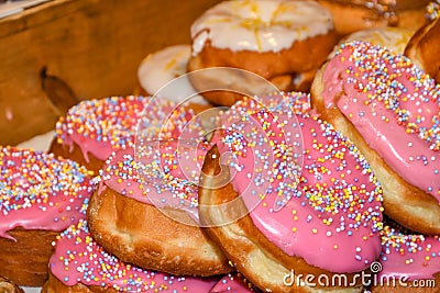 Many donuts placed in a tray, for sale at food market Stock Photo