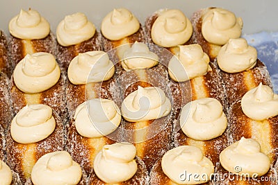 Many donuts placed in a tray, for sale at food market Stock Photo