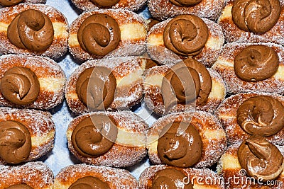 Many donuts placed in a tray, for sale at food market Stock Photo