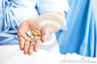 many drug therapy in the patient`s hand Stock Photo