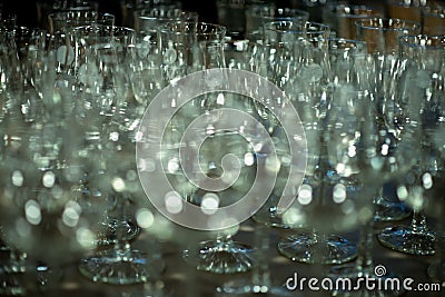 Many empty turquoise green drinking glasses, wine glasses on the table in the restaurant Stock Photo