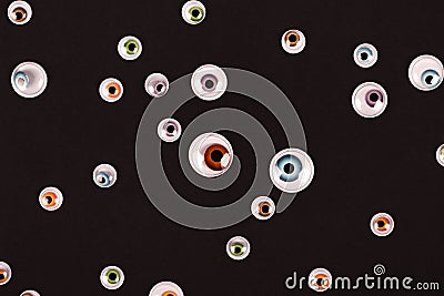 Many eyes on black background Stock Photo