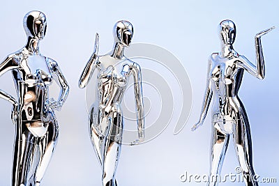 many fashion shiny female mannequins for clothes. Metallic manne Stock Photo