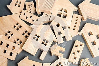 Many felled wooden houses. Destruction of houses as a result of natural disaster. The flood. Hurricane. Fire. Danger. Emergency Stock Photo