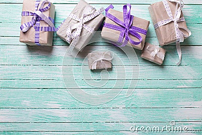 Many festive gift boxes with presents on turqoise wooden backg Stock Photo