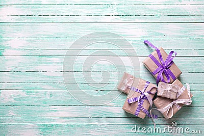 Many festive gift boxes with presents on turquoise wooden backg Stock Photo