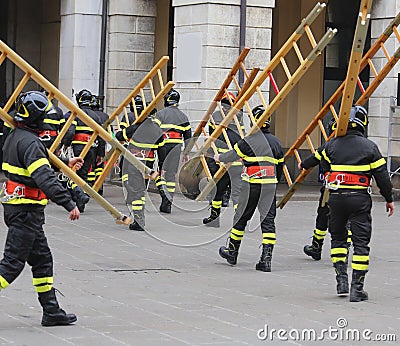 Many firefighters during exercise in the town square Stock Photo