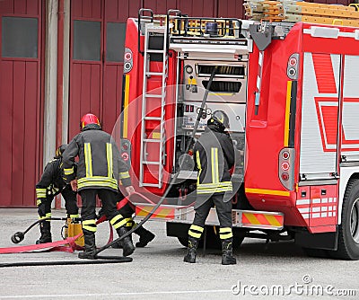 Firefighters and the fire truck during a pericles mission Stock Photo