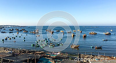 Many fishing boats dock at the pier in Phan Thiet, Vietnam Editorial Stock Photo