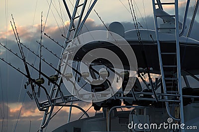 Many fishing rod on a boat at sunset Editorial Stock Photo