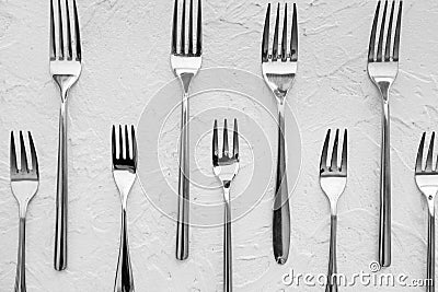 Many forks on white textured background, flat lay Stock Photo