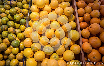 Many fresh and beautiful Oranges with a good taste in the basket at the market Stock Photo