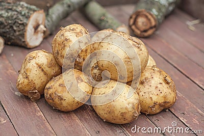 Many Fresh Potatoes on the brown wooden box Stock Photo